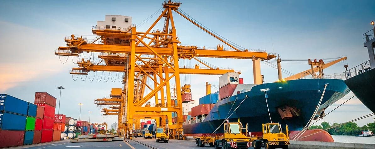 Ship-to-shore cranes and a container vessel at berth at Karachi Port