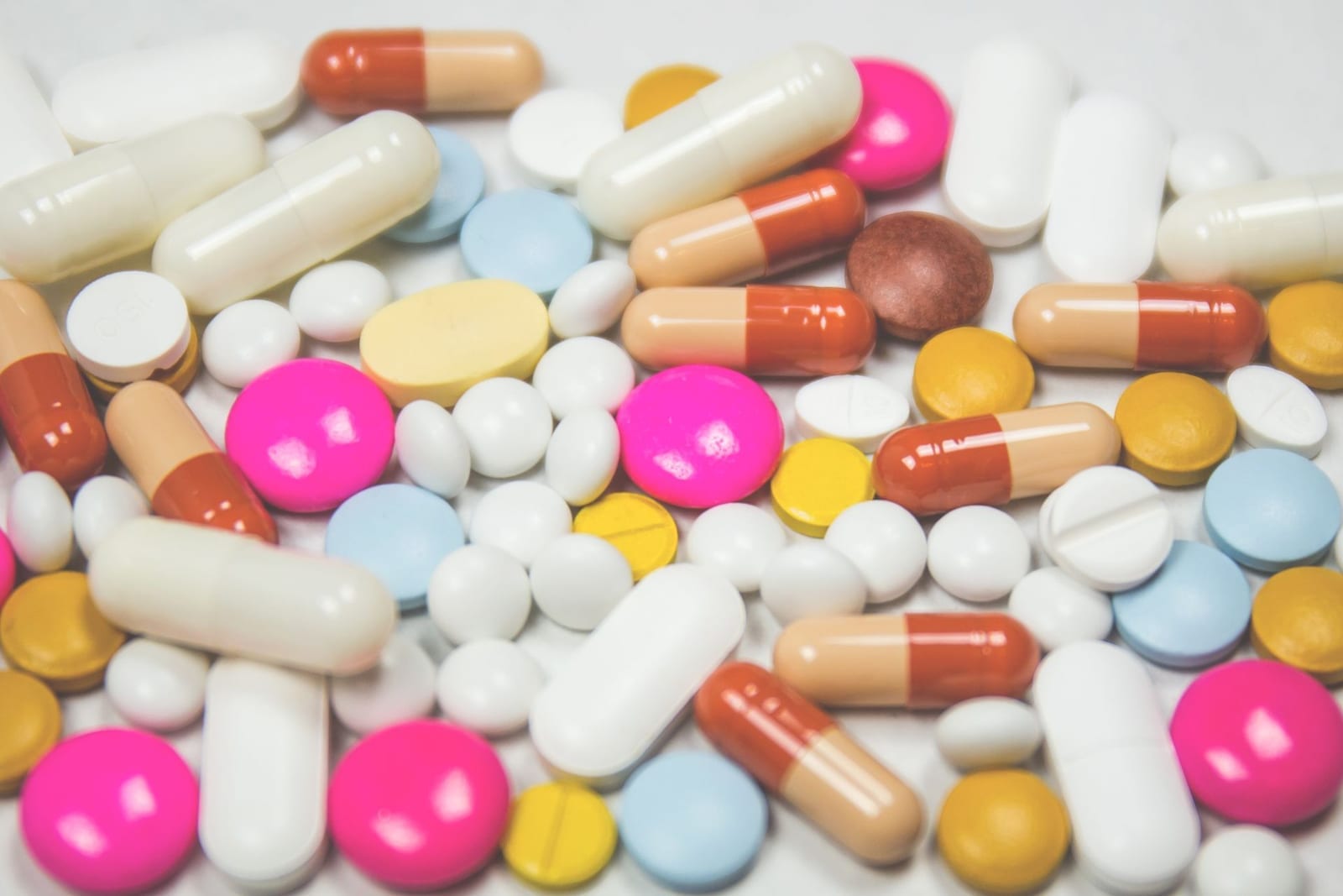 Assorted pharmaceutical tablets and capsules, representing medicines imported into Pakistan under DRAP clearance requirements