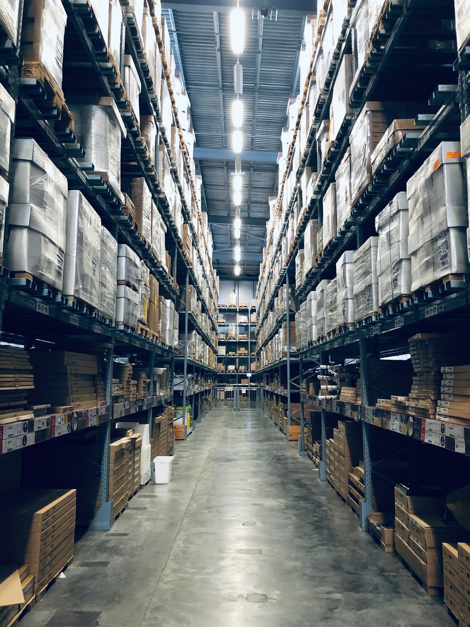 Racked warehouse aisles holding stored cargo